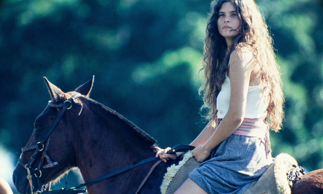 Shot from a telenovela of a young woman riding a horse