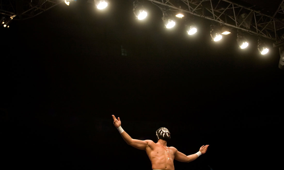 A masked luchador performing