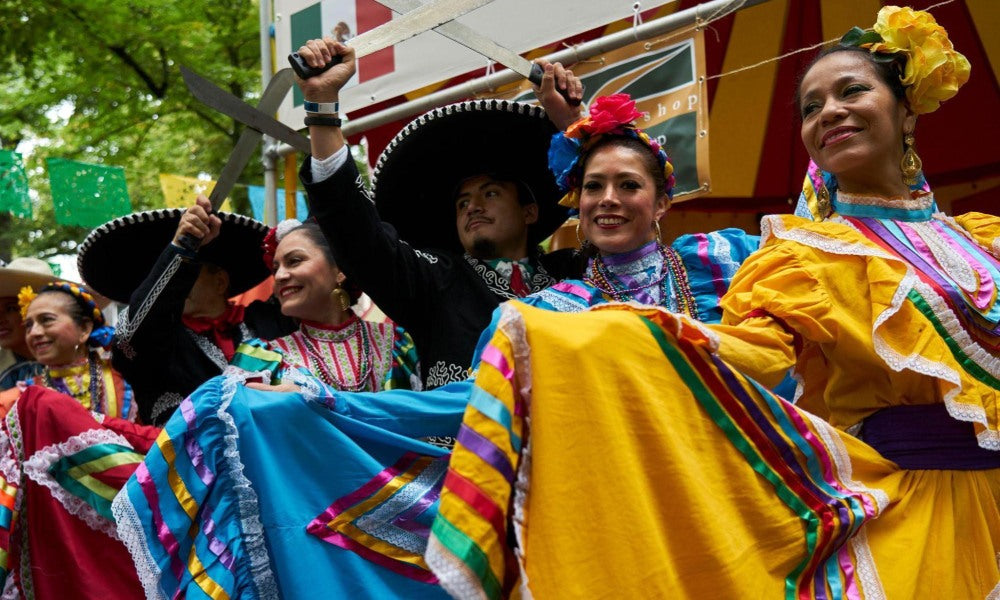Mexicans dress up for a fiesta in the street