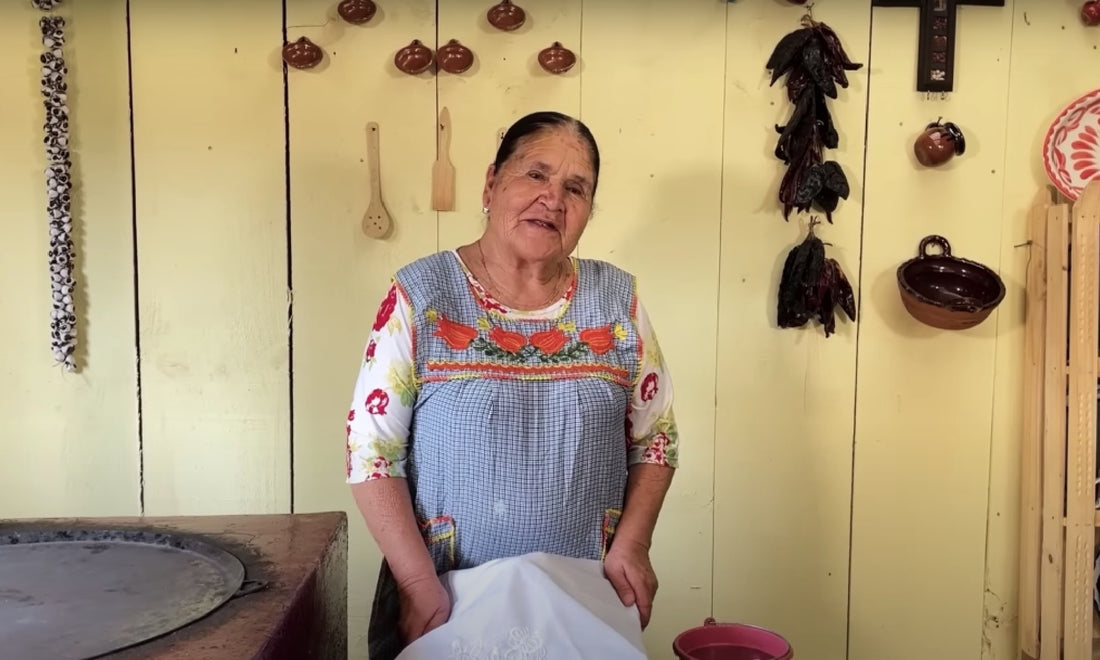 Doña Angela, YouTube cook, stands in her kitchen