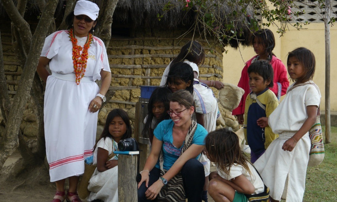 Olga Cuéllar with a group of young girls